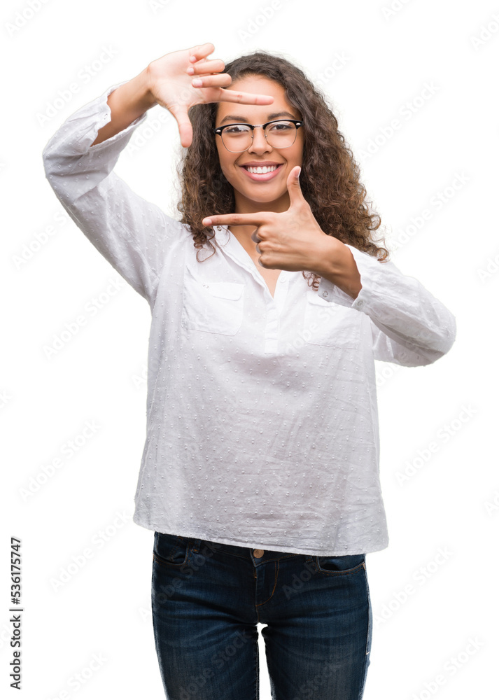 Beautiful young hispanic woman smiling making frame with hands and fingers with happy face. Creativity and photography concept. Beautiful young hispanic woman smiling making frame with hands and fingers with happy face. Creativity and photography concept.