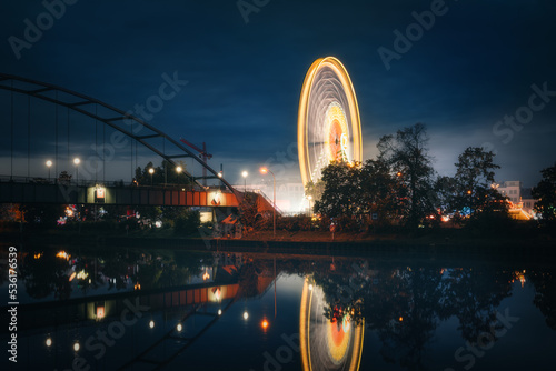 Blue hour view of Ferris Wheel at Volksfest, Cannstatter Wasen, Stuttgart Germany photo