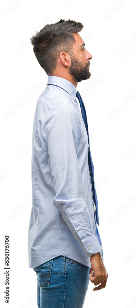 Adult hispanic business man over isolated background looking to side, relax profile pose with natural face with confident smile. Adult hispanic business man over isolated background looking to side, relax profile pose with natural face with confident smile.