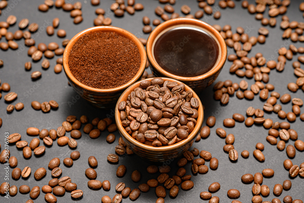 Three cups with different coffee, coffee beans, ground and ready-made drink. Three cups with different coffee, coffee beans, ground and ready-made drink.