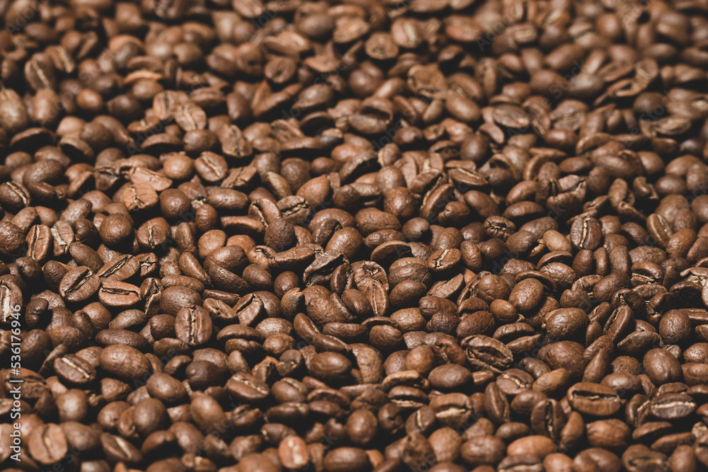 Texture of roasted coffee beans close-up, brown beans. Texture of roasted coffee beans close-up, brown beans.
