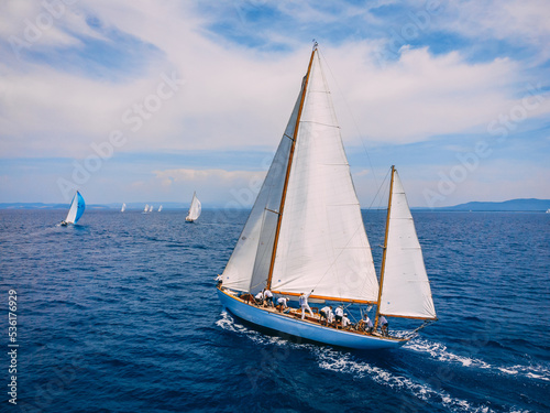 Classic wooden sailing ketch participating in regatta in the Mediterranean sea.