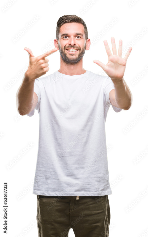 Young handsome man over isolated background showing and pointing up with fingers number seven while smiling confident and happy. Young handsome man over isolated background showing and pointing up with fingers number seven while smiling confident and happy.