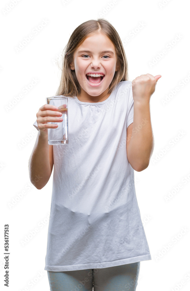 Young beautiful girl drinking glass of water over isolated background screaming proud and celebrating victory and success very excited, cheering emotion Young beautiful girl drinking glass of water over isolated background screaming proud and celebrating victory and success very excited, cheering emotion
