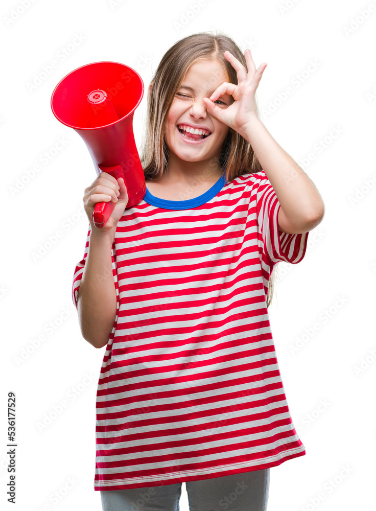Young beautiful girl yelling through megaphone over isolated background with happy face smiling doing ok sign with hand on eye looking through fingers Young beautiful girl yelling through megaphone over isolated background with happy face smiling doing ok sign with hand on eye looking through fingers