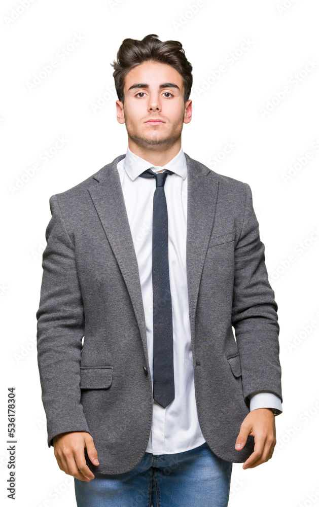 Young business man wearing suit and tie over isolated background with serious expression on face. Simple and natural looking at the camera. Young business man wearing suit and tie over isolated background with serious expression on face. Simple and natural looking at the camera.
