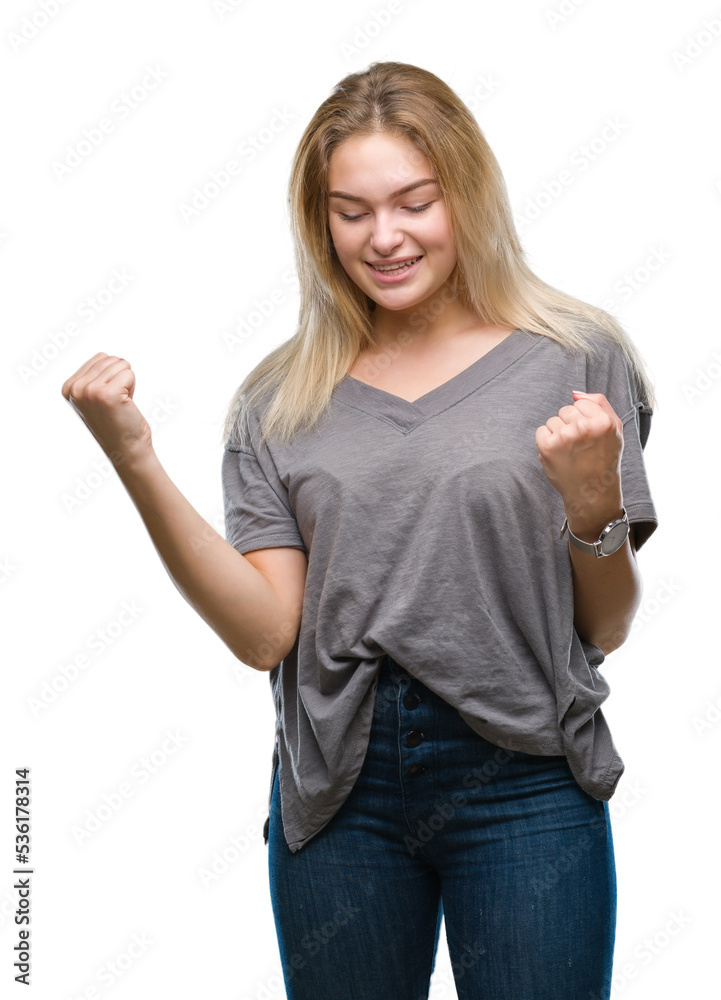 Young caucasian woman over isolated background very happy and excited doing winner gesture with arms raised, smiling and screaming for success. Celebration concept. Young caucasian woman over isolated background very happy and excited doing winner gesture with arms raised, smiling and screaming for success. Celebration concept.
