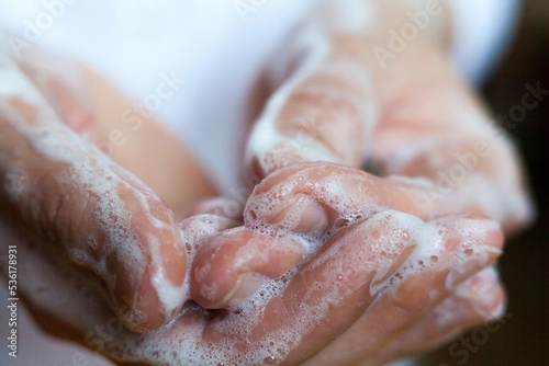 Washing hands. Rubbing with a soap. photo