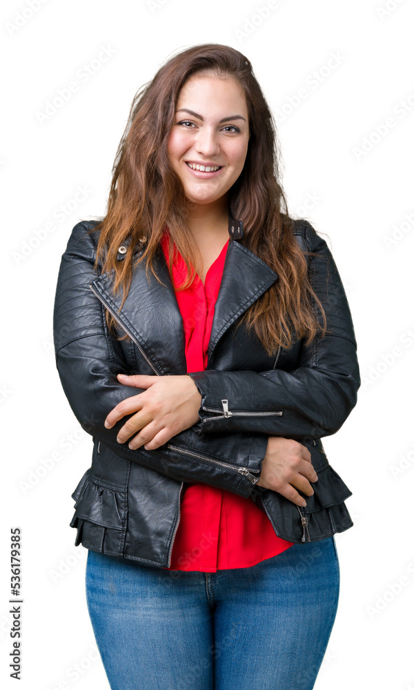 Obraz premium Beautiful plus size young woman wearing a fashion leather jacket over isolated background happy face smiling with crossed arms looking at the camera. Positive person.