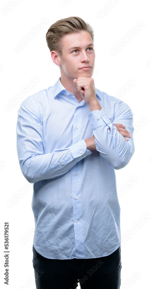 Young handsome blond man serious face thinking about question, very confused idea Young handsome blond man serious face thinking about question, very confused idea