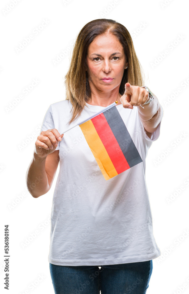 Middle age hispanic woman holding flag of Germany over isolated background pointing with finger to the camera and to you, hand sign, positive and confident gesture from the front Middle age hispanic woman holding flag of Germany over isolated background pointing with finger to the camera and to you, hand sign, positive and confident gesture from the front