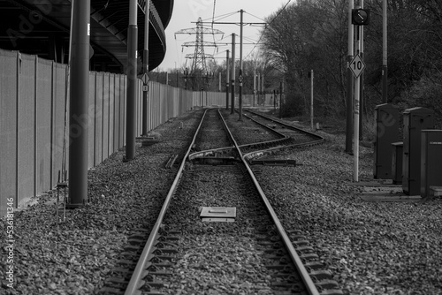 Black and white photo of tram tracks near Sheffield in England - stock photo.jpg