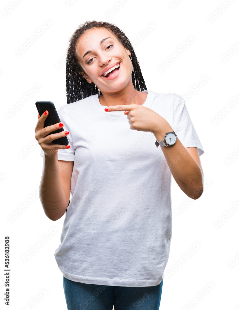Young braided hair african american girl showing using smartphone over isolated background very happy pointing with hand and finger Young braided hair african american girl showing using smartphone over isolated background very happy pointing with hand and finger