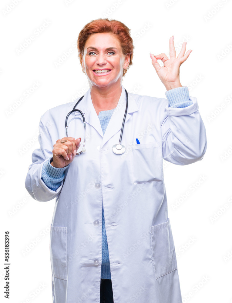 Senior caucasian doctor woman wearing medical uniform over isolated background smiling positive doing ok sign with hand and fingers. Successful expression. Senior caucasian doctor woman wearing medical uniform over isolated background smiling positive doing ok sign with hand and fingers. Successful expression.