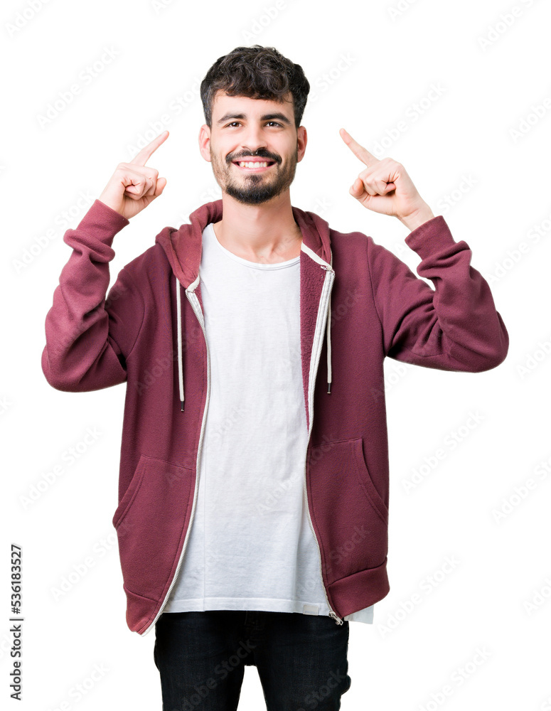 Fototapeta premium Young handsome man over isolated background Smiling pointing to head with both hands finger, great idea or thought, good memory