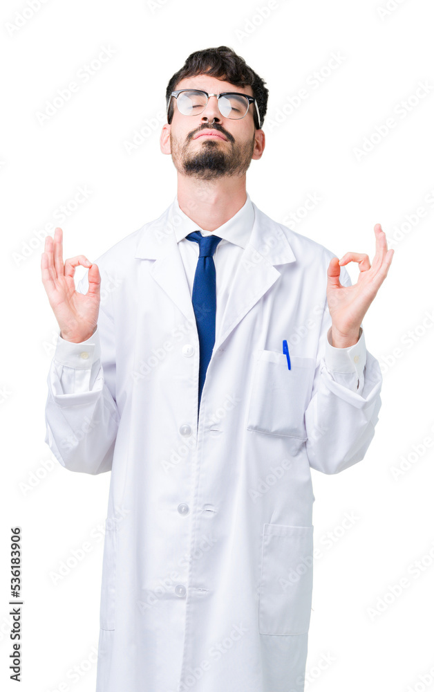Young professional scientist man wearing white coat over isolated background relax and smiling with eyes closed doing meditation gesture with fingers. Yoga concept.