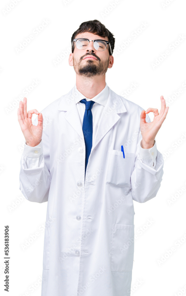 Young professional scientist man wearing white coat over isolated background relax and smiling with eyes closed doing meditation gesture with fingers. Yoga concept. Young professional scientist man wearing white coat over isolated background relax and smiling with eyes closed doing meditation gesture with fingers. Yoga concept.