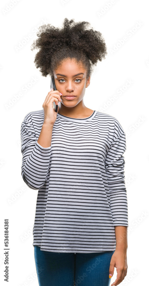 Young afro american woman talking on the phone over isolated background with a confident expression on smart face thinking serious