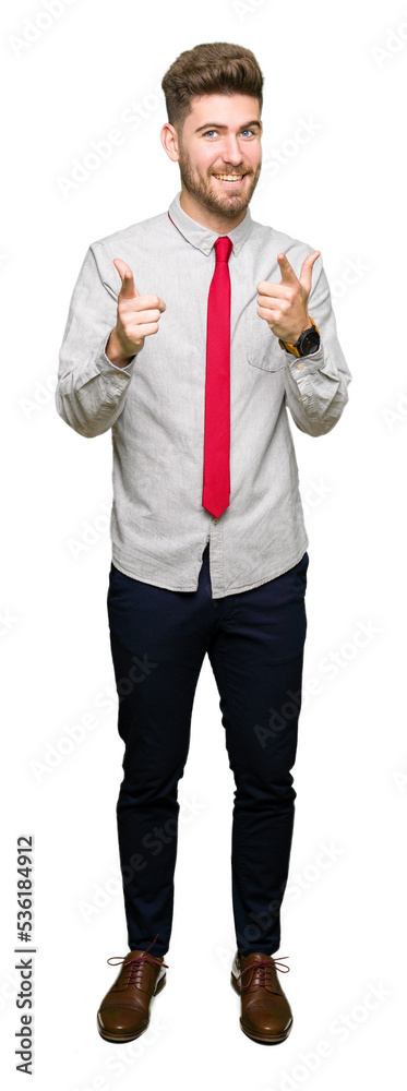 Young handsome business man pointing fingers to camera with happy and funny face. Good energy and vibes. Young handsome business man pointing fingers to camera with happy and funny face. Good energy and vibes.