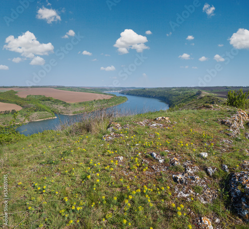 Amazing spring view on the Dnister River Canyon with picturesque rocks  fields  flowers. This place named Shyshkovi Gorby   Nahoriany  Chernivtsi region  Ukraine.