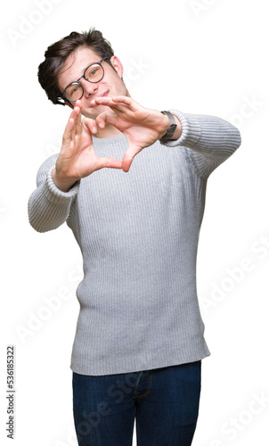 Young handsome man wearing glasses over isolated background smiling in love showing heart symbol and shape with hands. Romantic concept.
