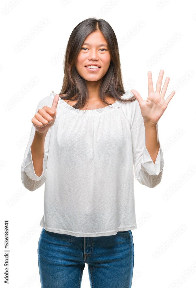 Young asian woman over isolated background showing and pointing up with fingers number six while smiling confident and happy. Young asian woman over isolated background showing and pointing up with fingers number six while smiling confident and happy.