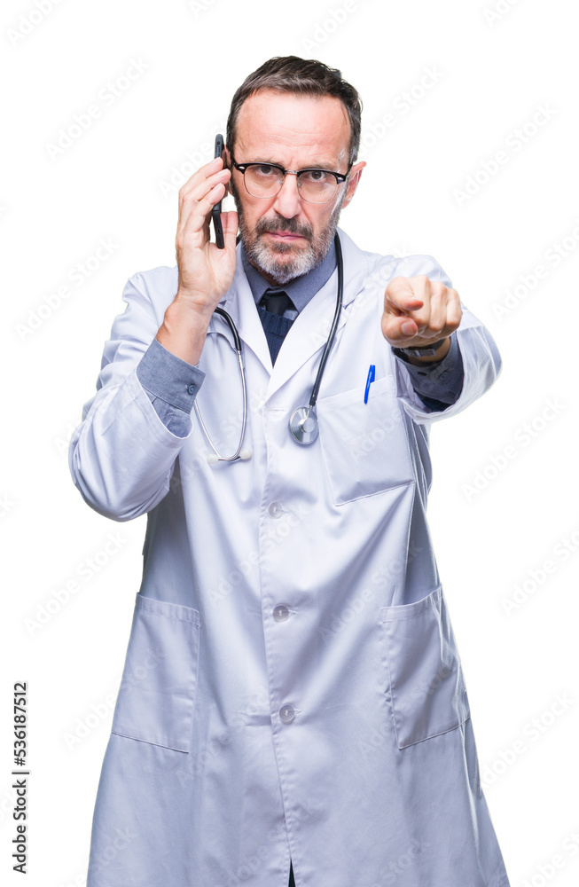 Middle age senior hoary doctor man talking on smartphone over isolated background pointing with finger to the camera and to you, hand sign, positive and confident gesture from the front Middle age senior hoary doctor man talking on smartphone over isolated background pointing with finger to the camera and to you, hand sign, positive and confident gesture from the front