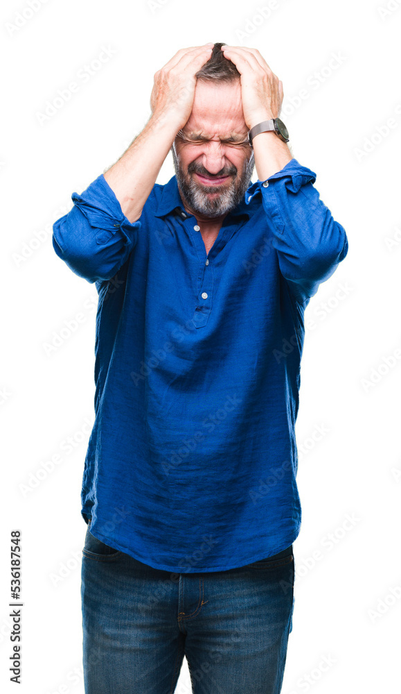 Middle age hoary senior man over isolated background suffering from headache desperate and stressed because pain and migraine. Hands on head. Middle age hoary senior man over isolated background suffering from headache desperate and stressed because pain and migraine. Hands on head.