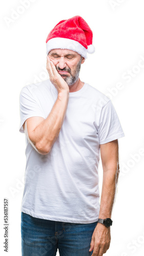 Middle age hoary senior man wearing christmas hat over isolated background thinking looking tired and bored with depression problems with crossed arms.