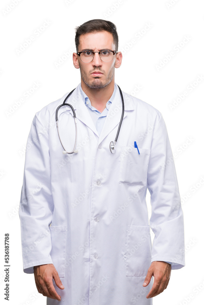 Handsome young doctor man skeptic and nervous, frowning upset because of problem. Negative person. Handsome young doctor man skeptic and nervous, frowning upset because of problem. Negative person.