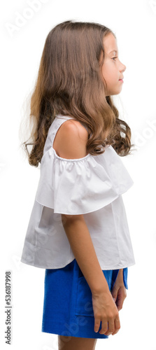 Brunette hispanic girl looking to side, relax profile pose with natural face with confident smile.