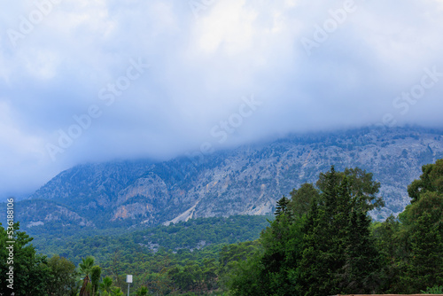 Foggy mountains with haze in Turkish resort place. Background