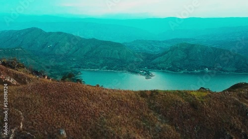 cinematic aerial view of the beautiful prado dam in tolima colombia. very blue inland sea of the country. concept of vacation..
