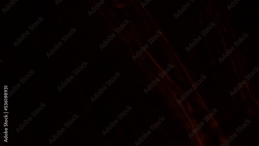 Abstract Shapes In Glowing Orange Strobe Light Against Black Abstract Shapes In Glowing Orange Strobe Light Against Black