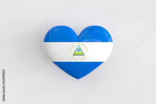 Souvenir of Nicaragua - a heart-shaped badge with the flag of Nicaragua as a symbol of patriotism and pride in their country. State symbol of Nicaragua on a glossy badge. 3D rendering