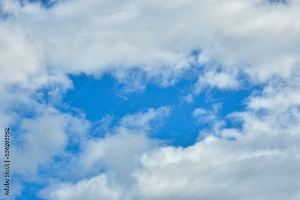 Naklejka premium White clouds against blue sky for a backgrounds