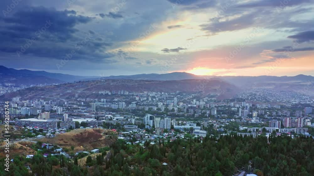 Scenic sunset above panoramic Tbilisi cityscape