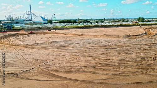 Motorcycle racing on a man made sand, beach track on Ingoldmells beach near Skegness, Lincolnshire, England. Drone footage. Ingoldmells motocross photo