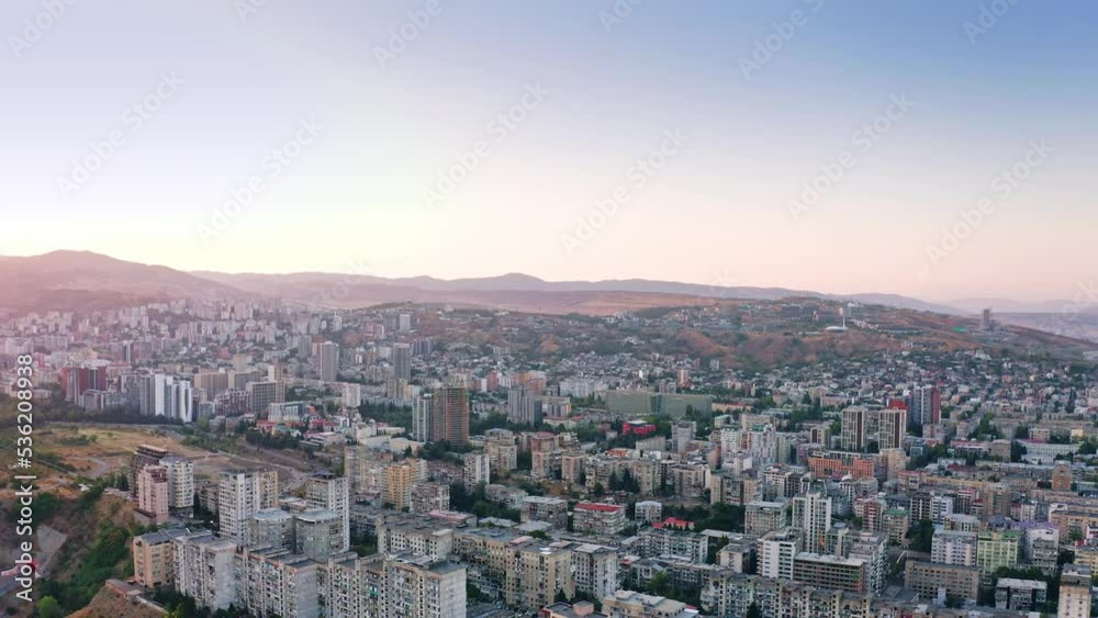 Beautiful sunset above Tbilisi urban skyline and mountains, Georgia Beautiful sunset above Tbilisi urban skyline and mountains, Georgia