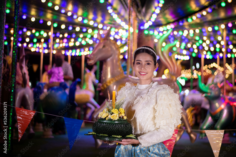 Thai woman wearing thai traditional dresses modern hold kratong,Loy Krathong Traditional Festival by bring Krathong to float in Loy kratong day of Thailand is religion travel concept. Thai woman wearing thai traditional dresses modern hold kratong,Loy Krathong Traditional Festival by bring Krathong to float in Loy kratong day of Thailand is religion travel concept.