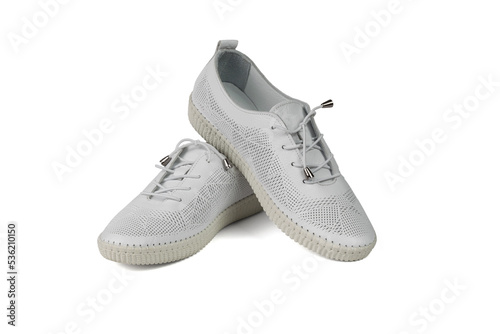 Leather white shoes made of perforated leather insulated on a white background.