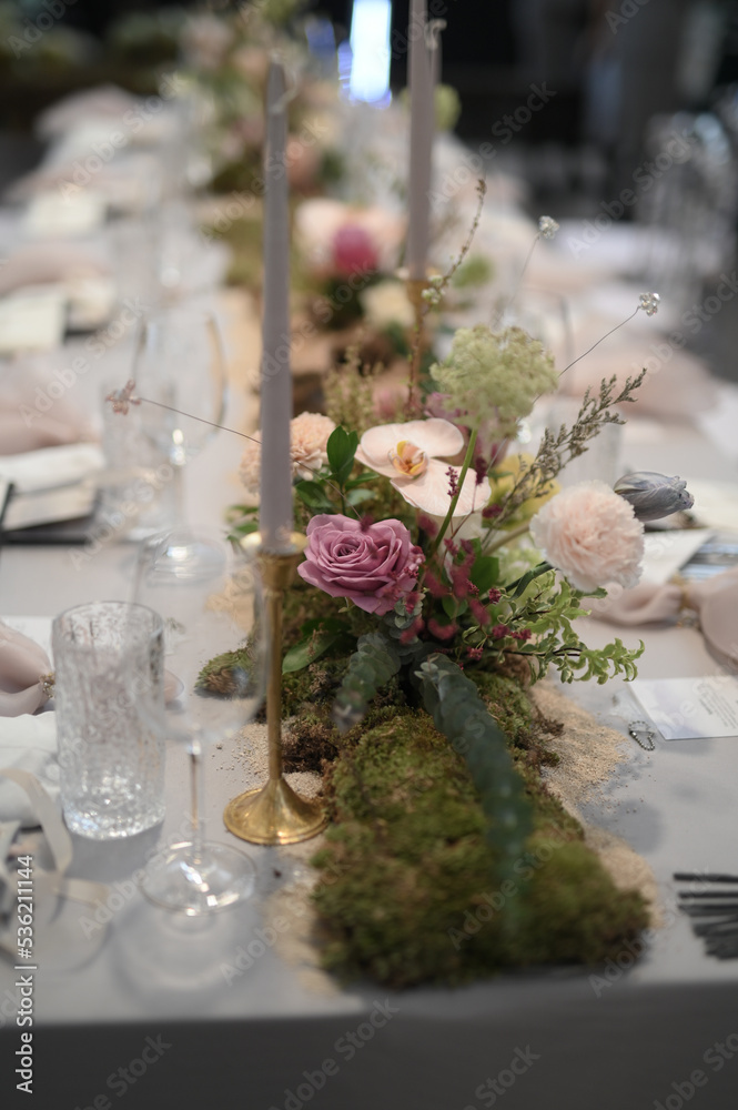 Flowers decoration for wedding or fine dinning table in private party. Family intimacy dinner night outdoors with clear tent