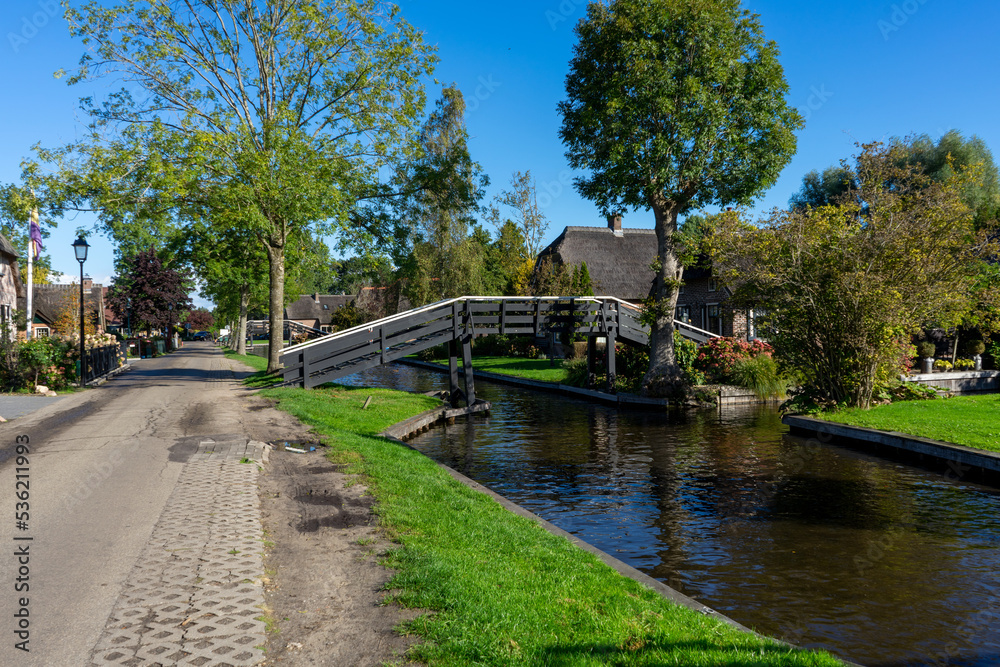 Giethoorn Netherlands Venice of the North bridge and canal in the village and foothpath walkway