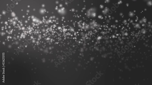 4K. Snowflakes falling winter night dark sky background. 