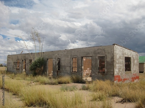 Abandoned Building with Stormy Clouds Rolling In Behind It