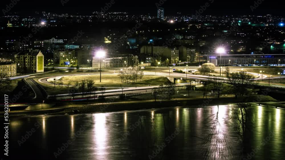 Busy Road With Lot Of Cars Travelling And Bright City Lights Background During Nighttime In Riga, Latvia. - Hyperlapse Busy Road With Lot Of Cars Travelling And Bright City Lights Background During Nighttime In Riga, Latvia. - Hyperlapse