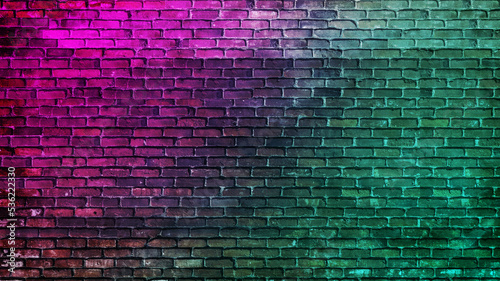 Toned brick wall. blue purple magenta teal green rough surface. gradient. colorful background with space for design. dark. grungy backdrop  cracked  damaged collapse ruins