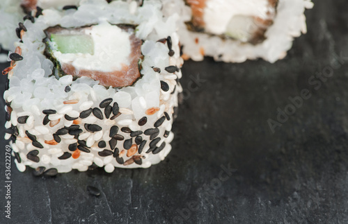 Japanese sushi roll philadelphia on black stone