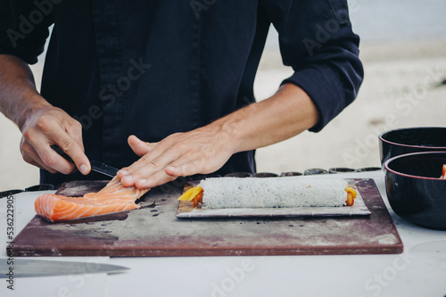 Chef cook making sushi outdoor photo