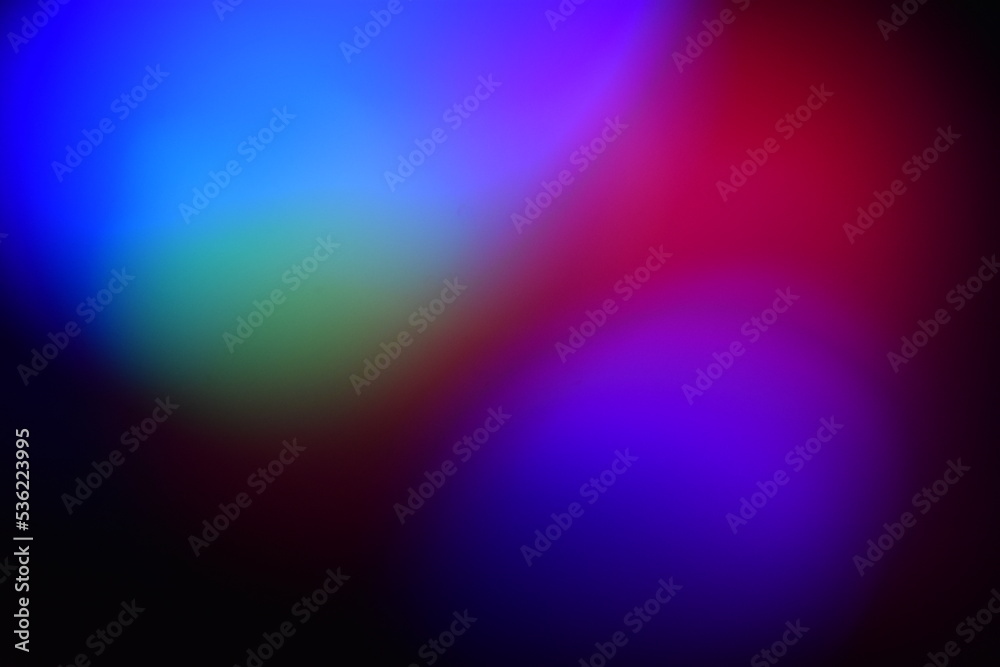 Fototapeta premium Multicolored round blurry spots garland on black background